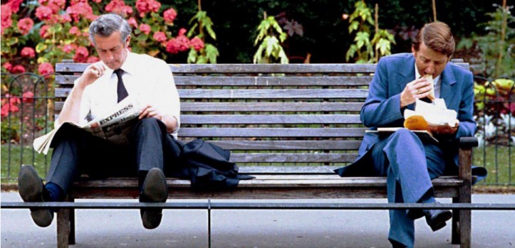 BUSINESSMEN RELAXING IN THE PARK DURING HEATWAVE WEATHER IN BRITAIN